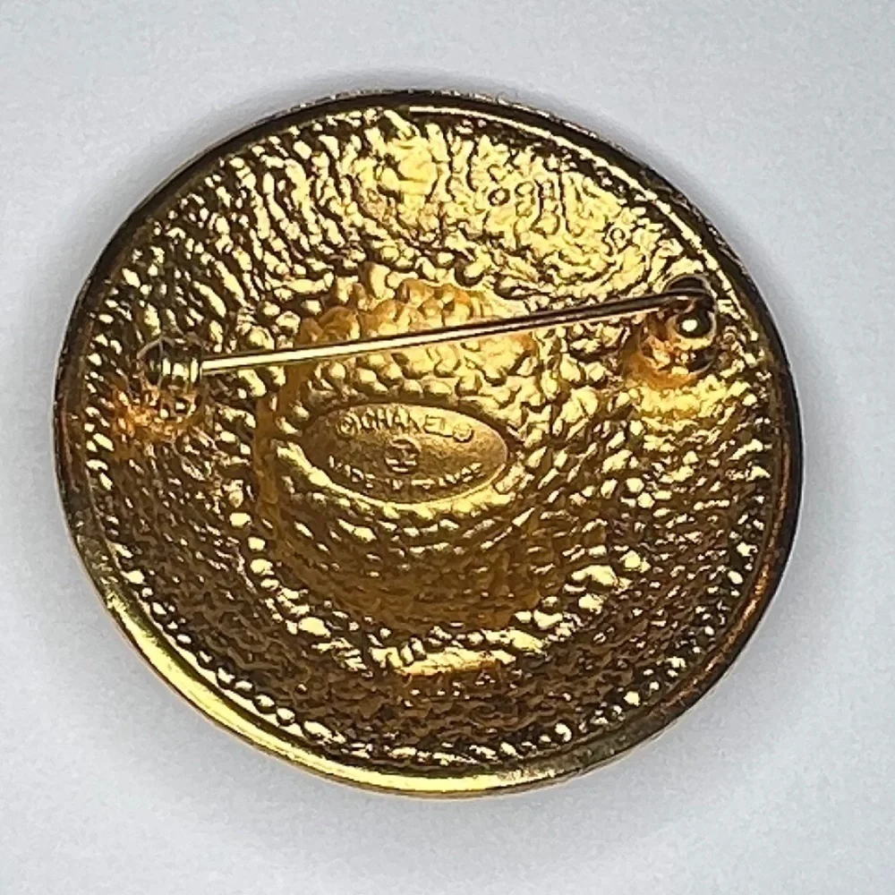 Vintage gold Chanel Brooch.